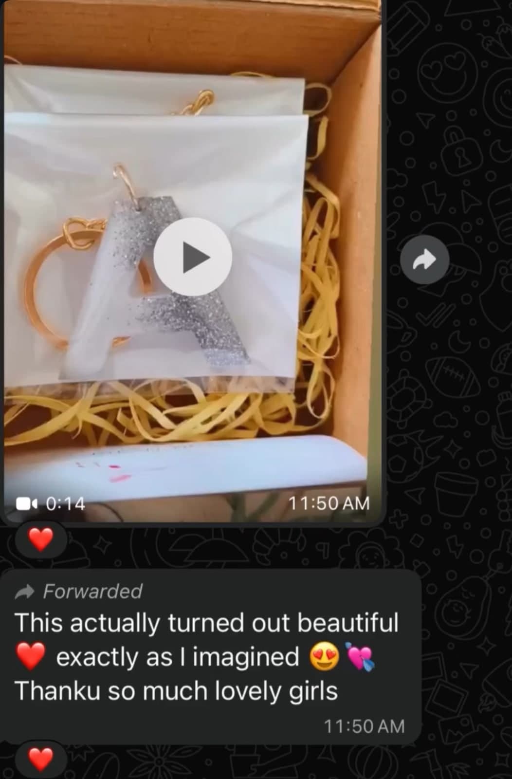 WhatsApp screenshot of a customer forwarding a video of a silver glitter letter A keychain in its box, with the message 'This actually turned out beautiful, exactly as I imagined. Thanku so much lovely girls'